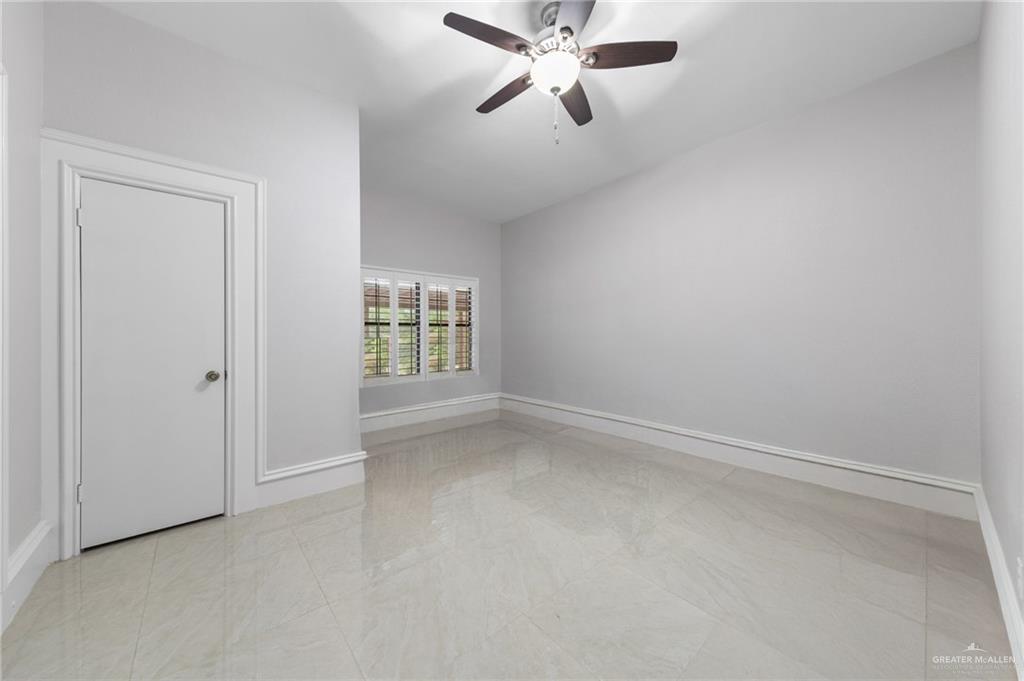 10409 North Ware Road McAllen, TX 78504 - Photo 27 of 45 an empty room with windows and fan