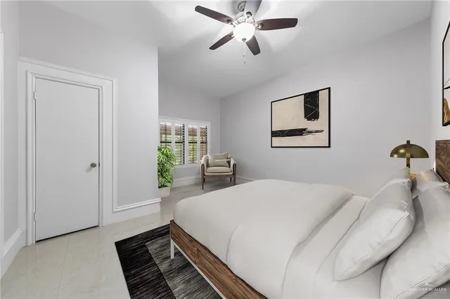 a bed room with a bed and a chandelier