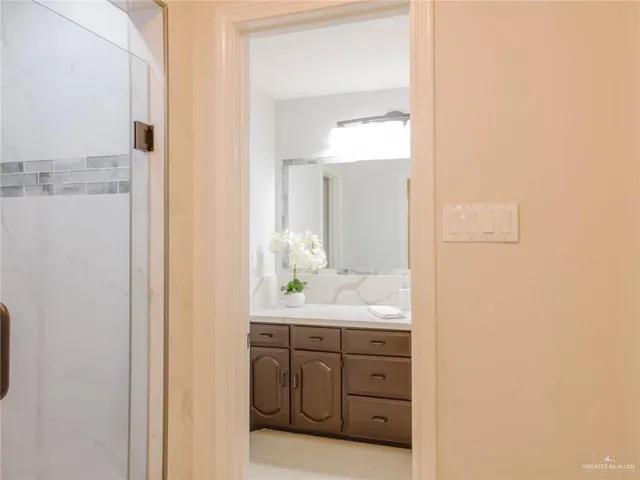 a bathroom with a double vanity sink and mirror
