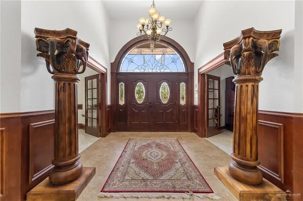 a view of hall way with furniture