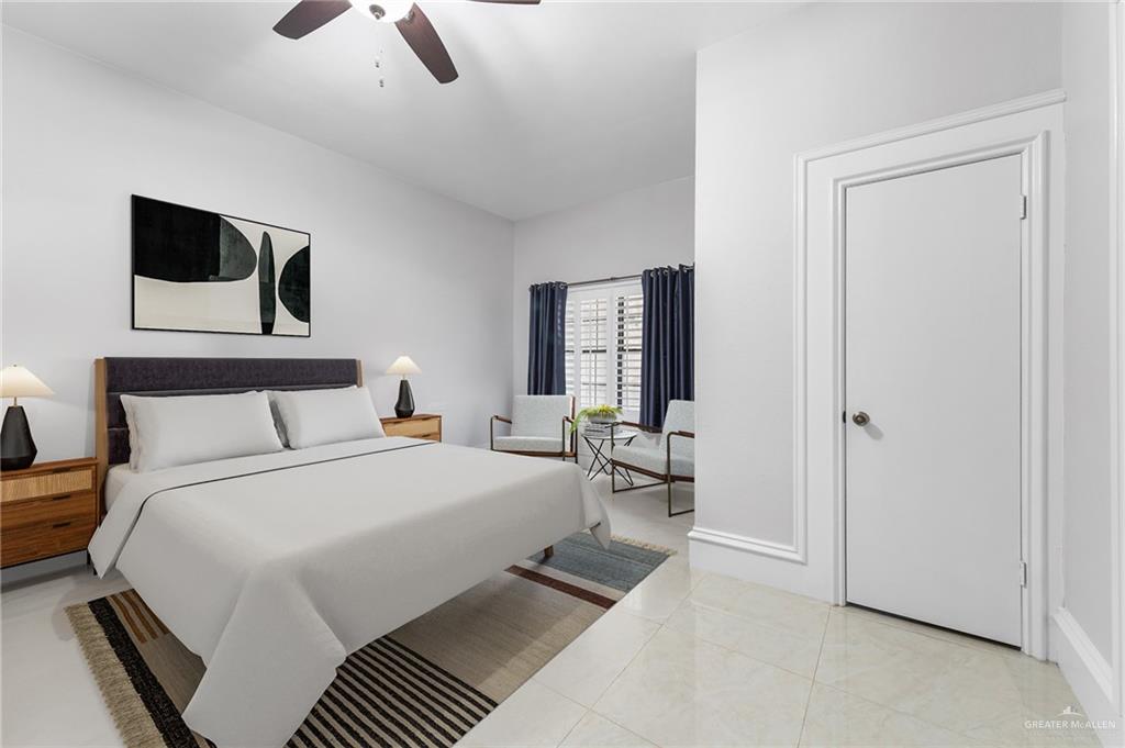 10409 North Ware Road McAllen, TX 78504 - Photo 33 of 45 a bedroom with a bed a mirror and night stand