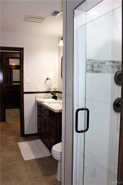 10409 North Ware Road McAllen, TX 78504 - Photo 34 of 45 a bathroom with a sink a toilet and shower