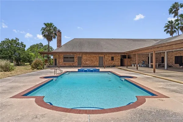 front view of house with a swimming pool