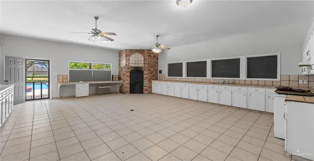 a large white room with windows and furniture