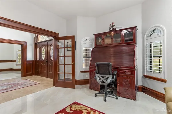 a view of a livingroom with furniture and a window