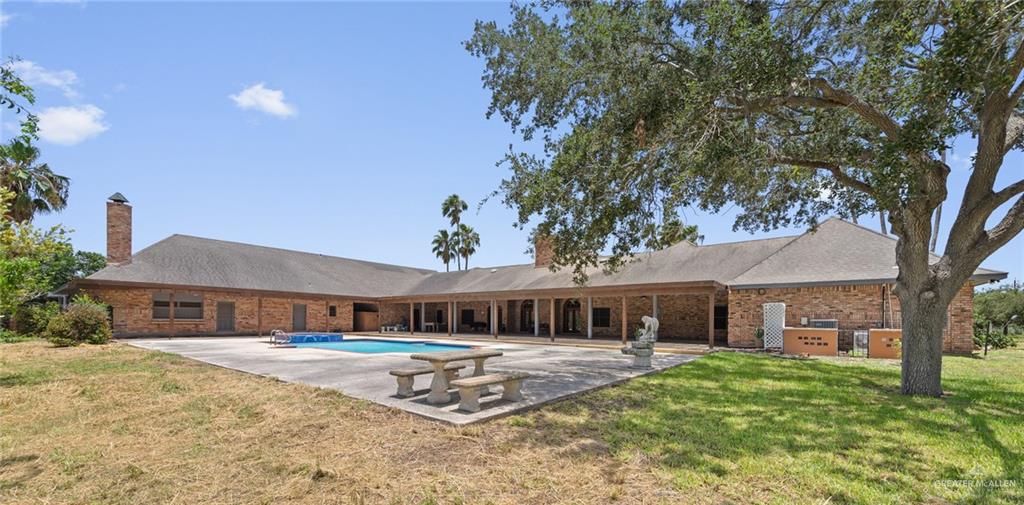 10409 North Ware Road McAllen, TX 78504 - Photo 41 of 45 a front view of a house with a yard