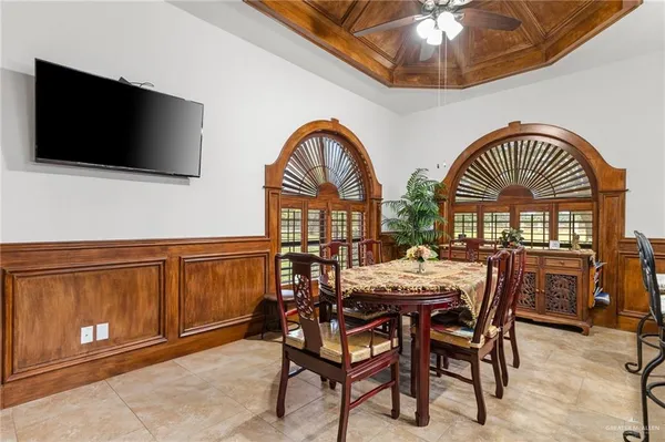 a view of a livingroom with furniture and a flat screen tv