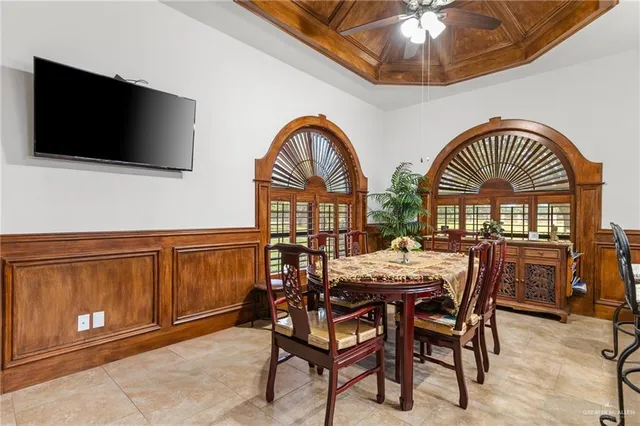 a view of a livingroom with furniture and a flat screen tv