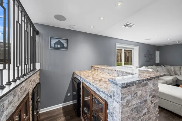 a bath room with a table and chairs