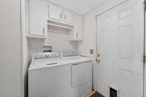 a utility room with dryer and washer