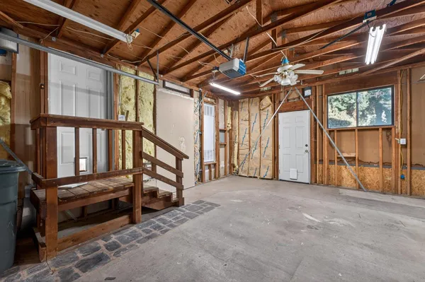 a view of an empty room with stairs