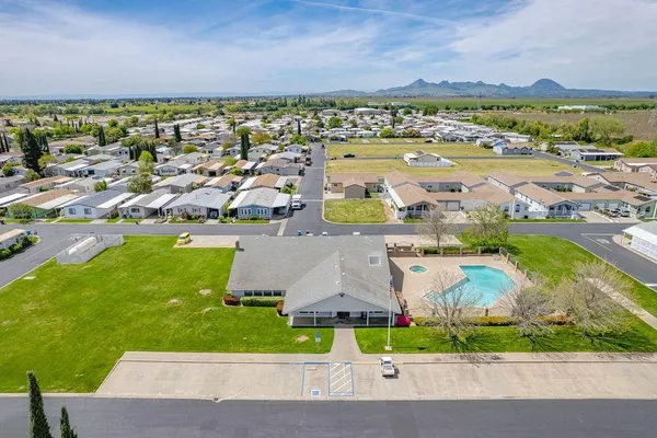 an aerial view of residential building and lake view