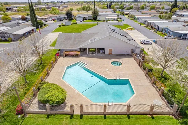 an aerial view of a house with swimming pool