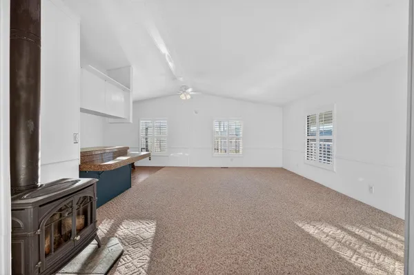 a view of a kitchen with electric appliances