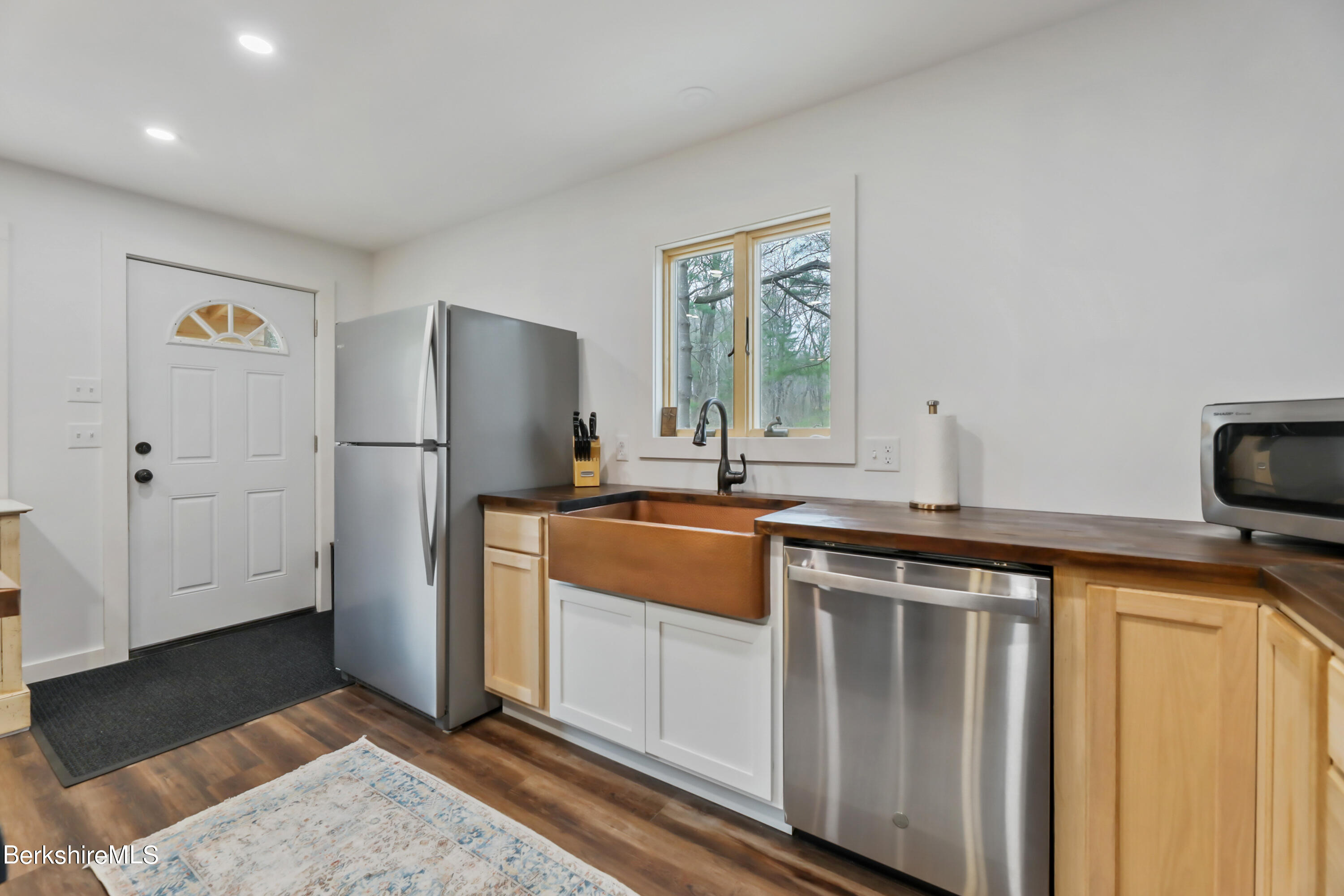 40 Mohekunuk Road Becket, MA 01223 - Photo 8 of 20 a kitchen with stainless steel appliances granite countertop a refrigerator and a stove