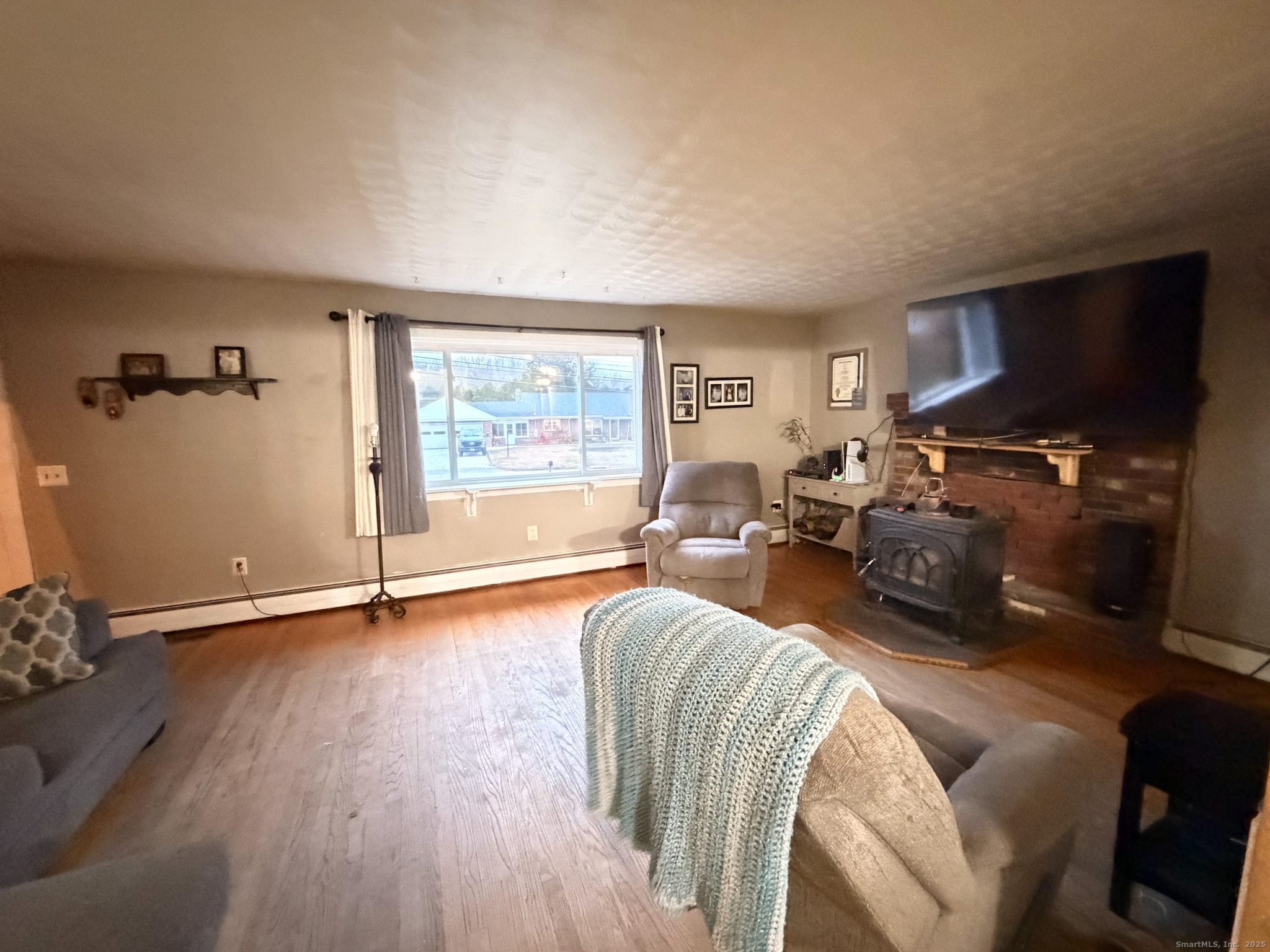 3 Ferland Drive Killingly, CT 06241 - Photo 11 of 19 a living room with furniture a flat screen tv and a large window