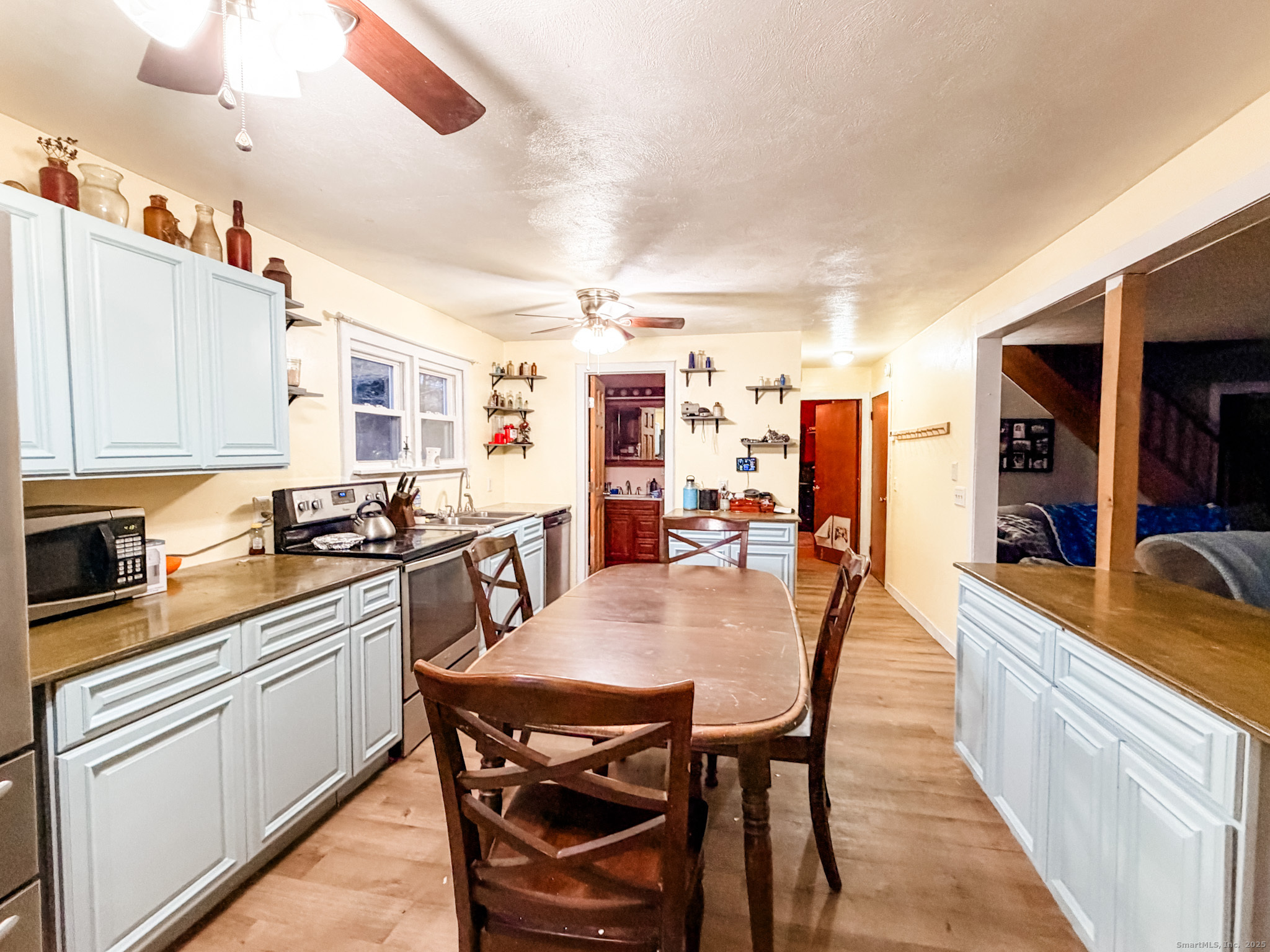 3 Ferland Drive Killingly, CT 06241 - Photo 3 of 19 a kitchen with stainless steel appliances kitchen island granite countertop a sink and cabinets