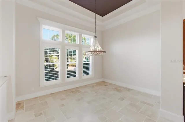 a kitchen with granite countertop a sink and a stove