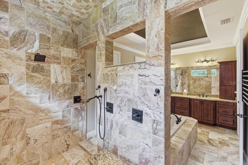 7 Spanish Moss Court Palm Coast, FL 32137 - Photo 27 of 66 a bathroom with a tub sink and shower