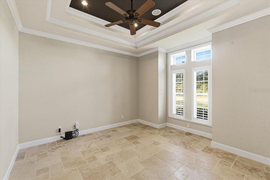 7 Spanish Moss Court Palm Coast, FL 32137 - Photo 34 of 66 an empty room with a ceiling fan and window