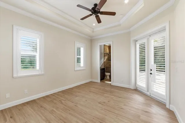 a bathroom with a granite countertop sink a mirror and a bathtub