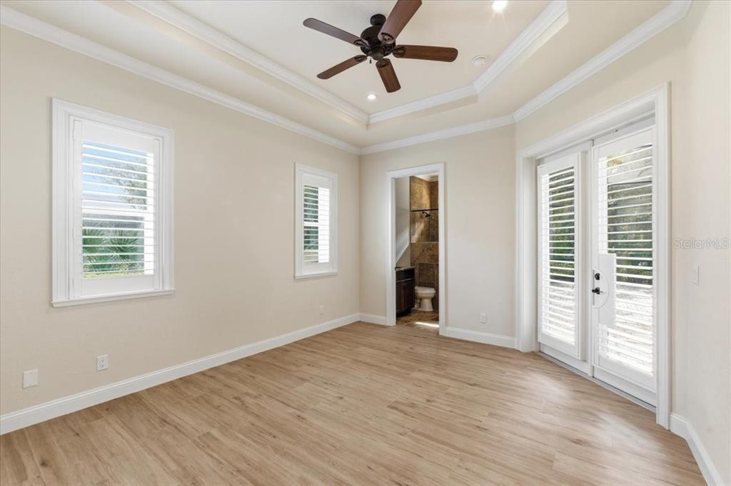 7 Spanish Moss Court Palm Coast, FL 32137 - Photo 36 of 66 a view of empty room with wooden floor and fan