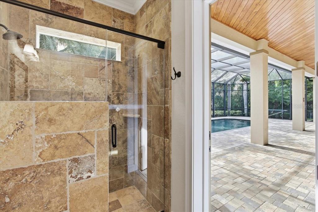 7 Spanish Moss Court Palm Coast, FL 32137 - Photo 41 of 66 a view of a bathroom with a glass door shower