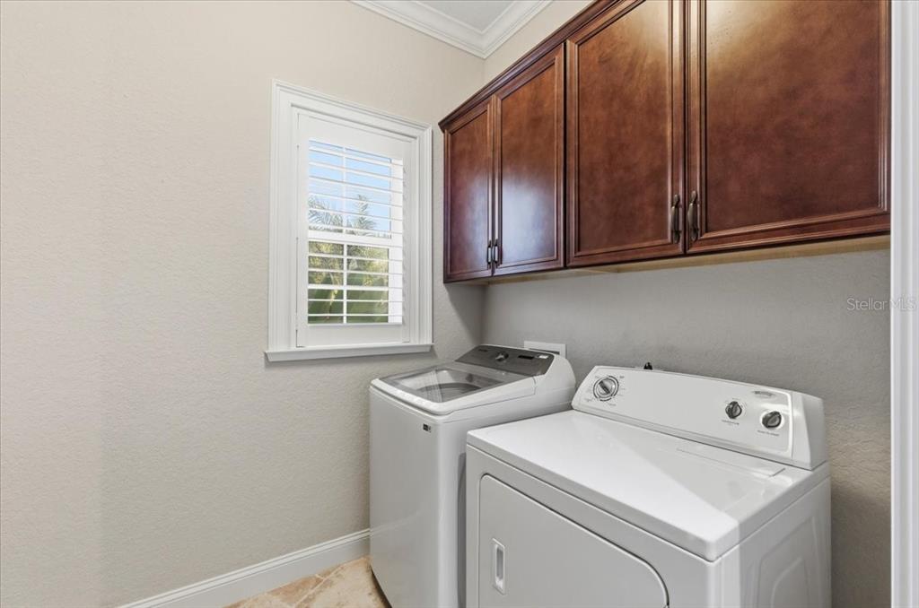 7 Spanish Moss Court Palm Coast, FL 32137 - Photo 47 of 66 a utility room with dryer and washer