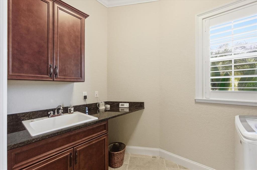7 Spanish Moss Court Palm Coast, FL 32137 - Photo 48 of 66 a utility room with dryer and washer