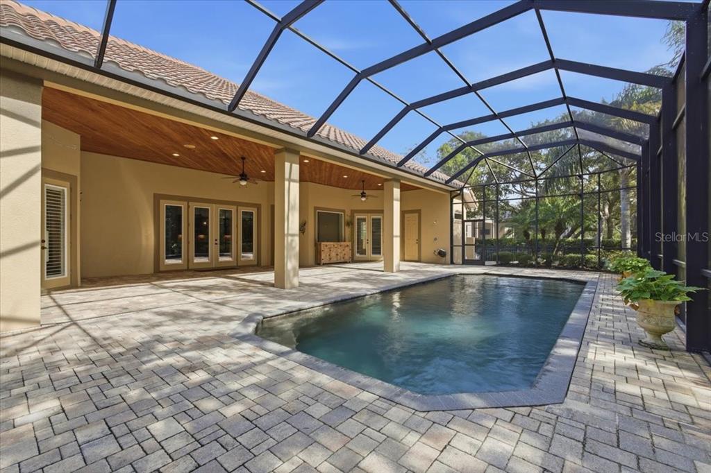 7 Spanish Moss Court Palm Coast, FL 32137 - Photo 5 of 66 a view of a swimming pool with a patio