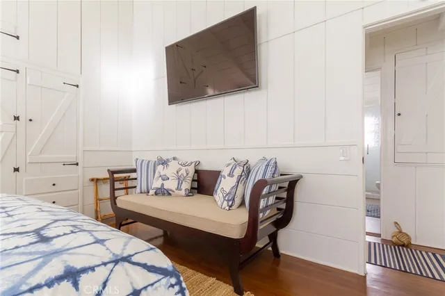 a bedroom with a bed and a chair