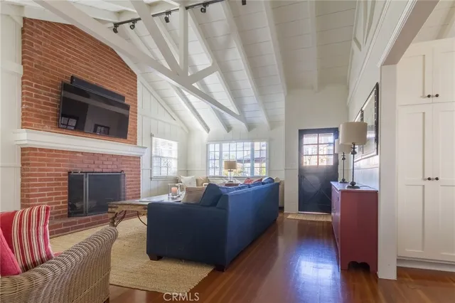 a living room with furniture or fireplace and a wooden floor