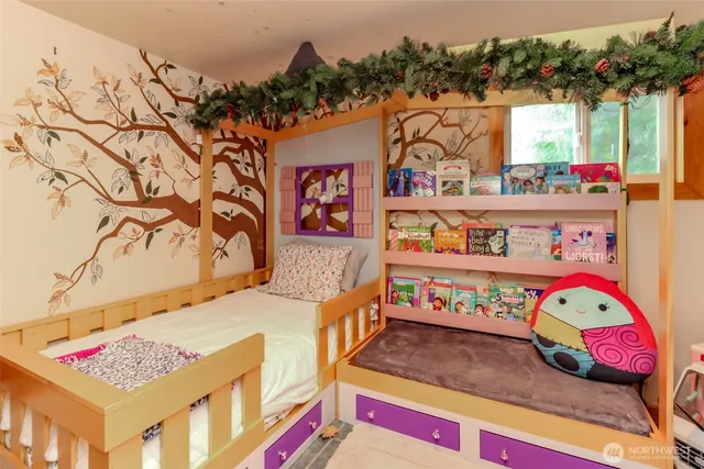 a bedroom with bed and a window