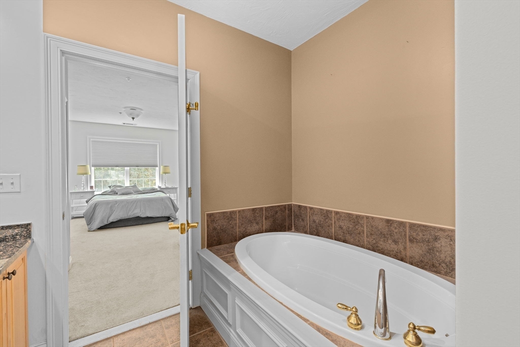 2204 Davenport Avenue, Unit 2204 Canton, MA 02021 - Photo 16 of 28 a bathroom with a tub and a sink