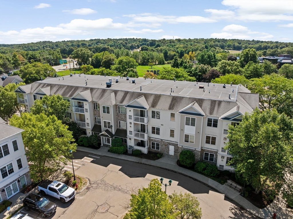 2204 Davenport Avenue, Unit 2204 Canton, MA 02021 - Photo 26 of 28 a view of a building with a garden