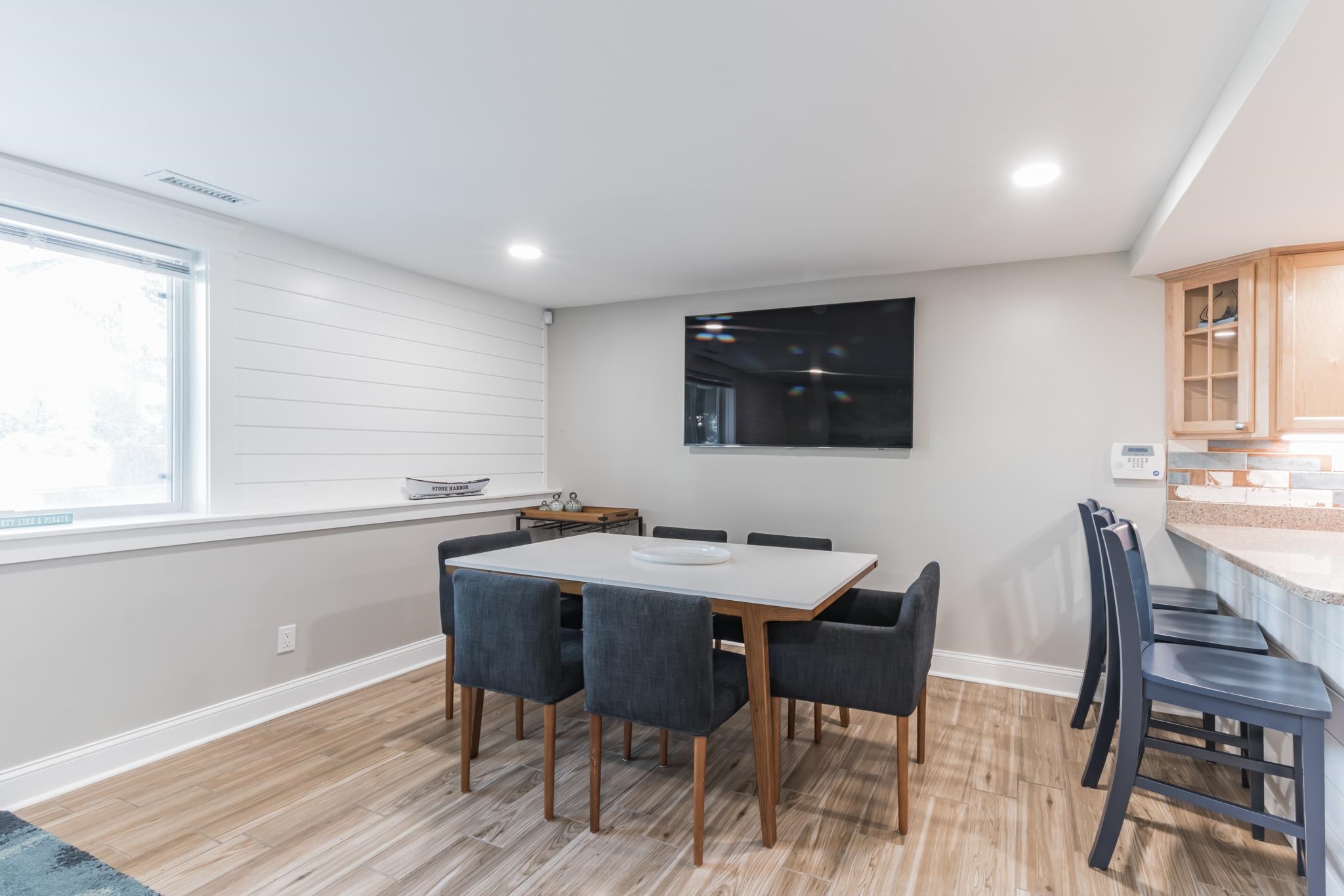 15 99th Street, Unit A Stone Harbor, NJ 08247 - Photo 14 of 41 a view of a dining room with furniture and wooden floor