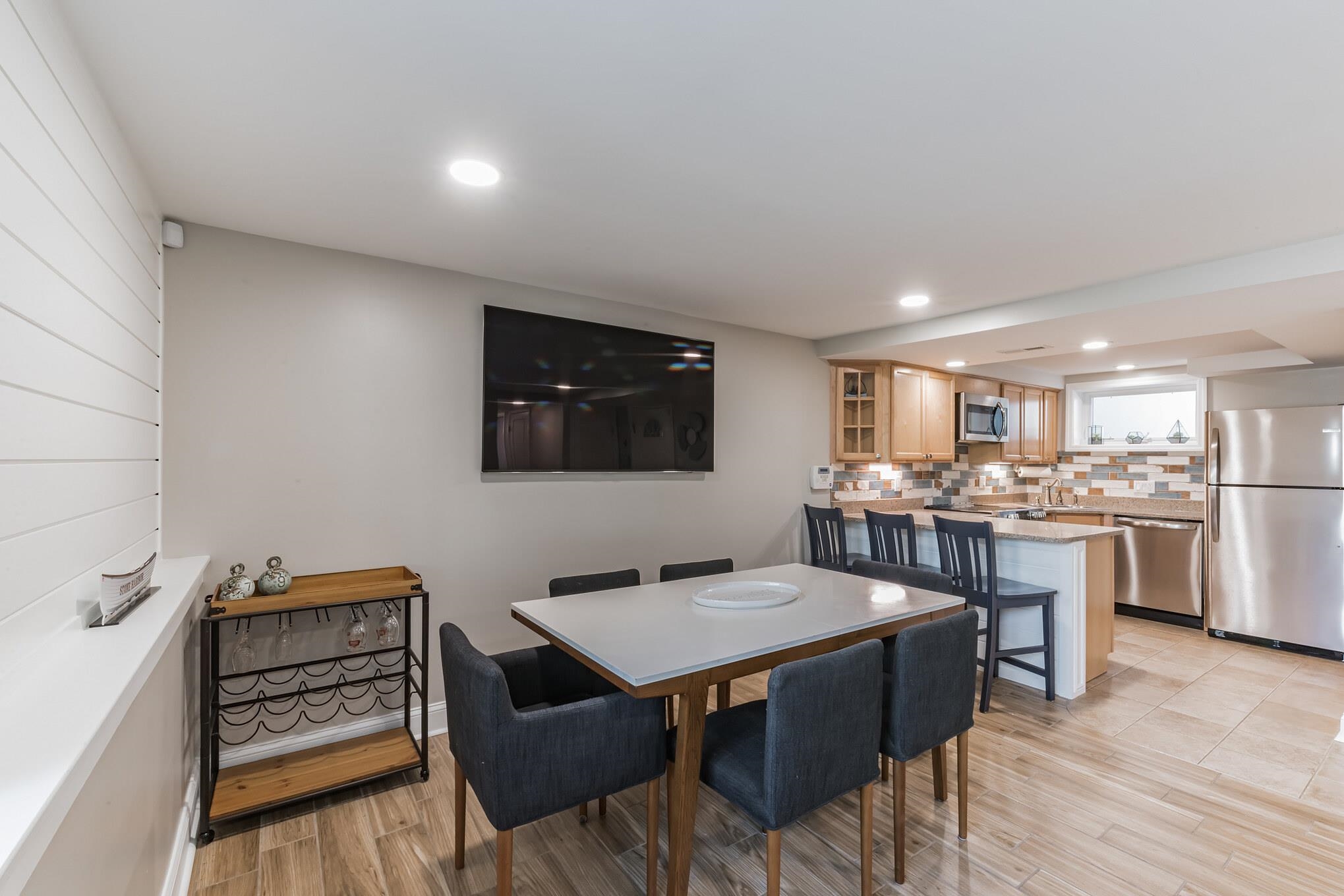 15 99th Street, Unit A Stone Harbor, NJ 08247 - Photo 15 of 41 a open kitchen with a table and chairs in it