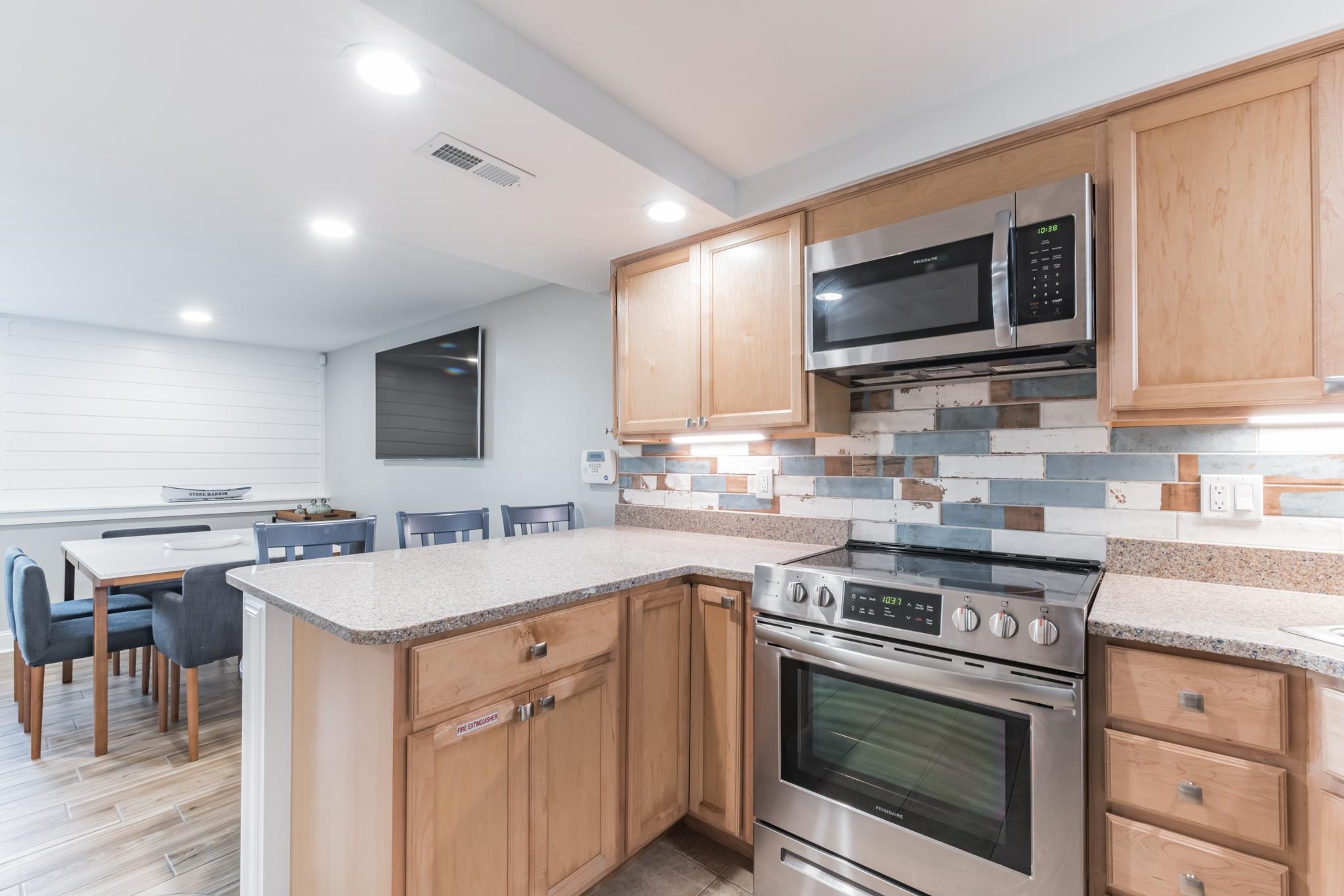 15 99th Street, Unit A Stone Harbor, NJ 08247 - Photo 20 of 41 a kitchen with a sink stove and microwave