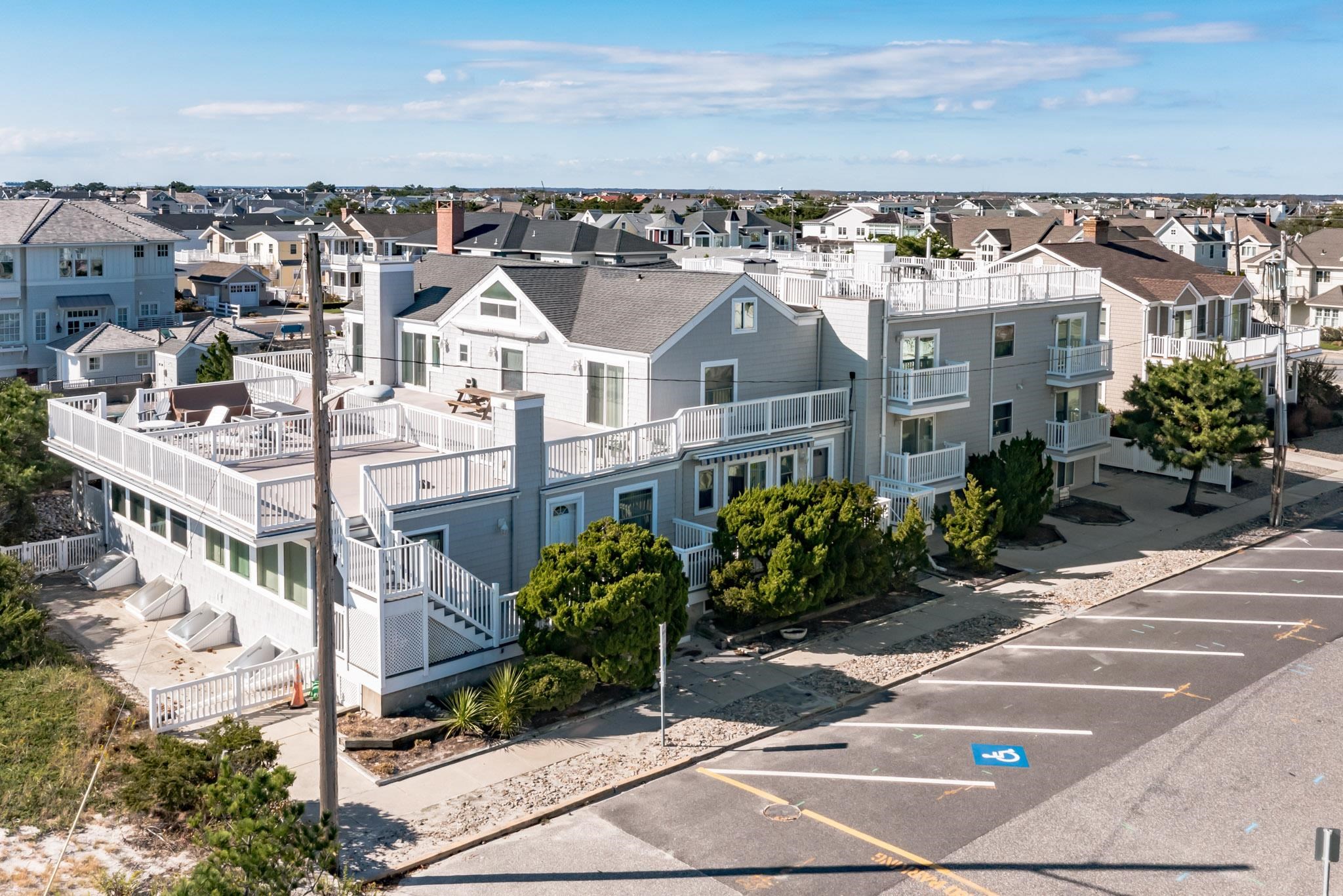 15 99th Street, Unit A Stone Harbor, NJ 08247 - Photo 2 of 41 a view of a city with tall buildings in the background