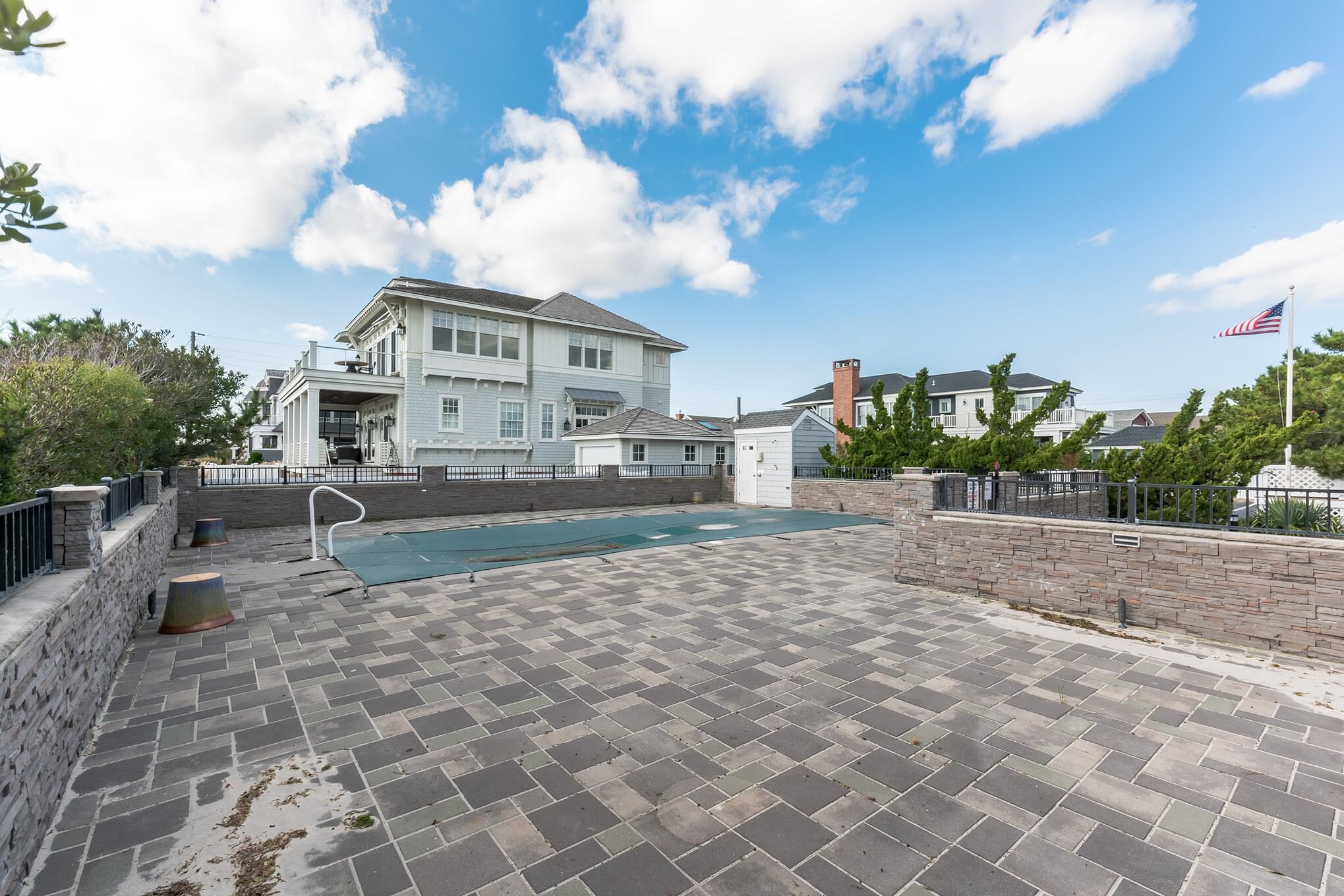 15 99th Street, Unit A Stone Harbor, NJ 08247 - Photo 31 of 41 a view of a house with a yard
