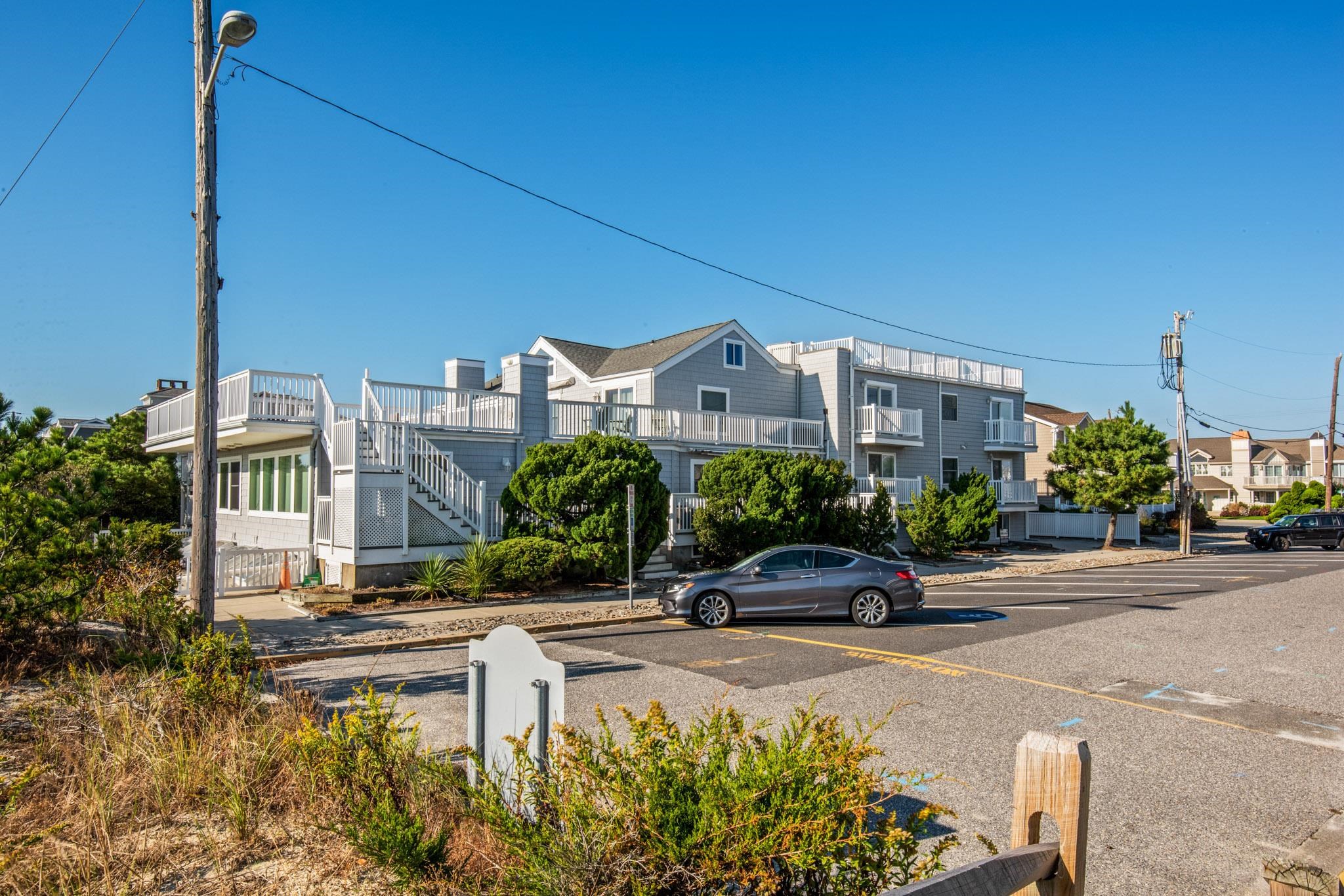 15 99th Street, Unit A Stone Harbor, NJ 08247 - Photo 5 of 41 a car parked in front of a house