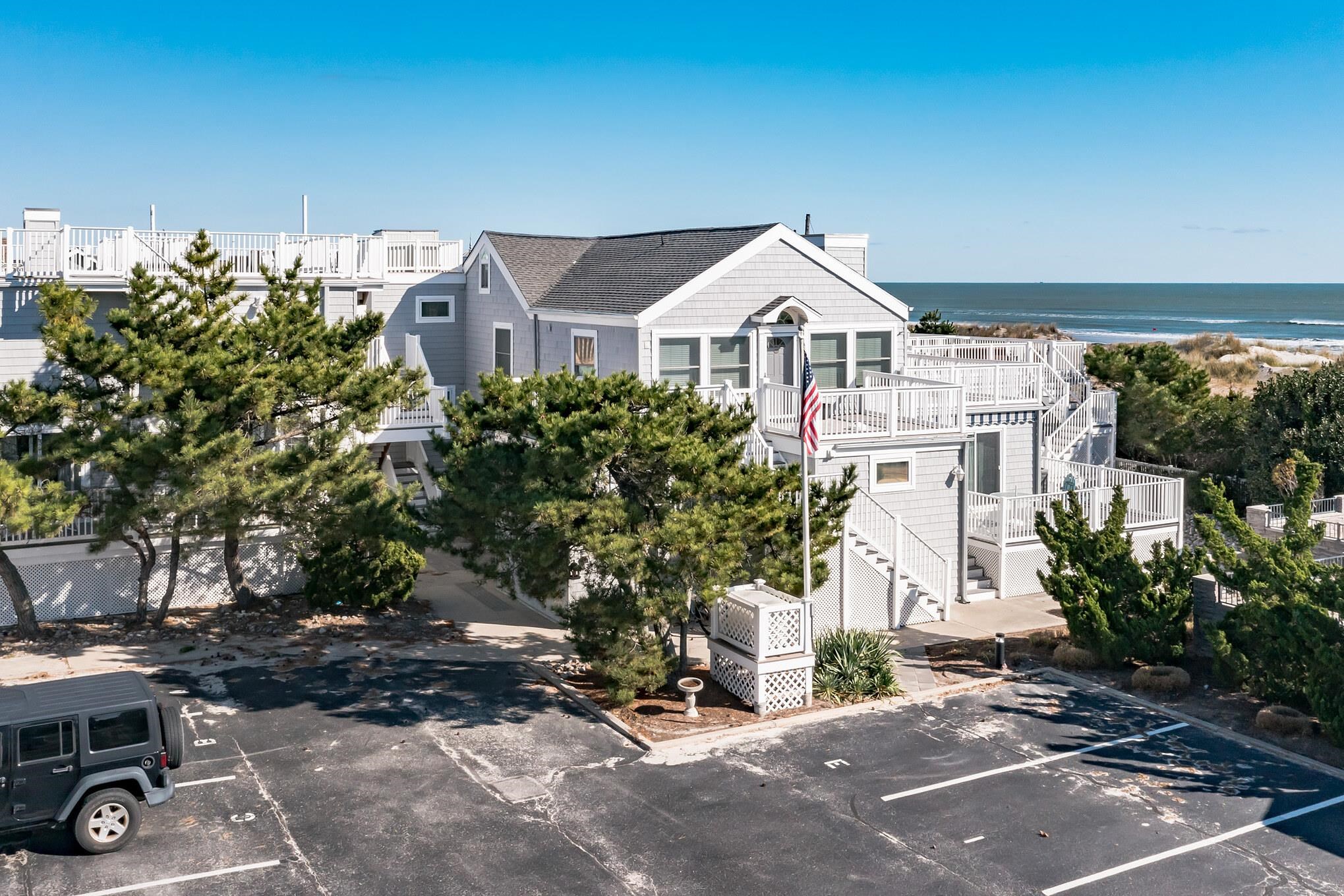 15 99th Street, Unit A Stone Harbor, NJ 08247 - Photo 6 of 41 a front view of a house with a yard