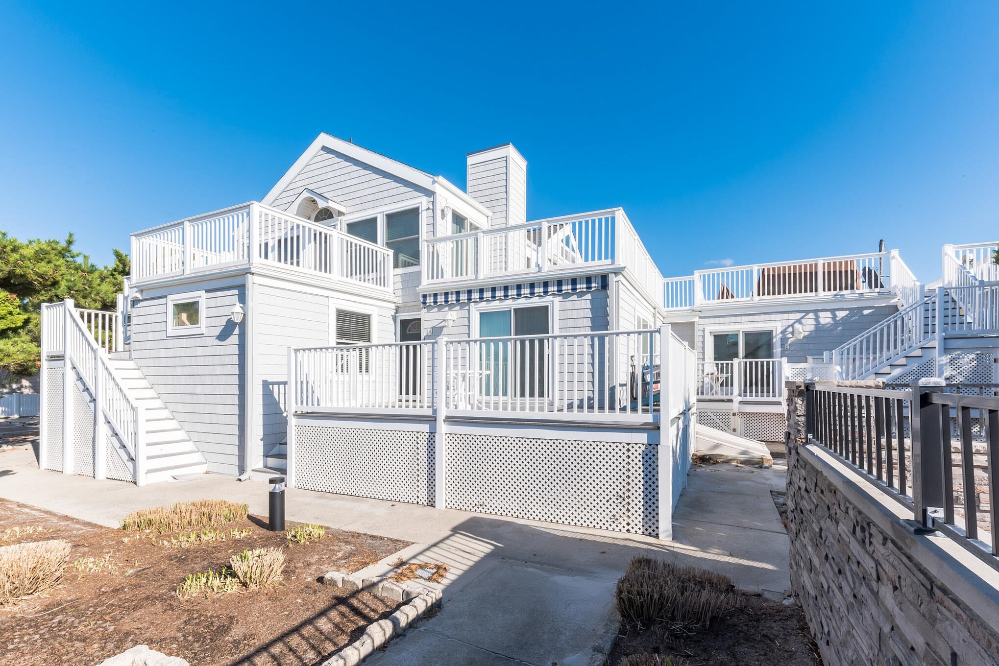 15 99th Street, Unit A Stone Harbor, NJ 08247 - Photo 7 of 41 a view of a house with wooden fence