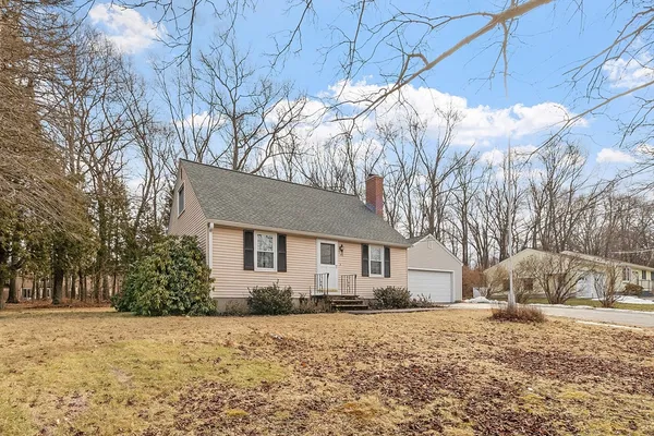 a house that has a tree in front of it