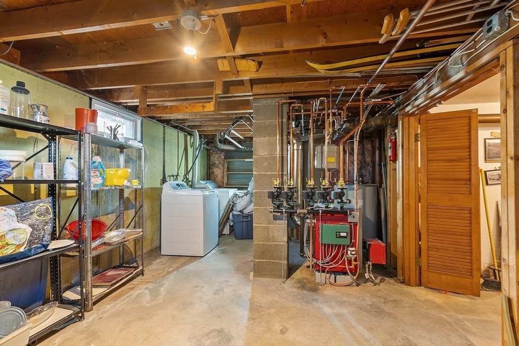 46 Woodruff Road Clinton, MA 01510 - Photo 33 of 38 a view of a storage room with a lot of stuff and furniture