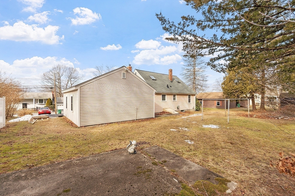 46 Woodruff Road Clinton, MA 01510 - Photo 36 of 38 a view of a house with backyard and a tree