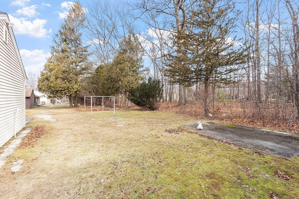 46 Woodruff Road Clinton, MA 01510 - Photo 37 of 38 a house with trees in front of it
