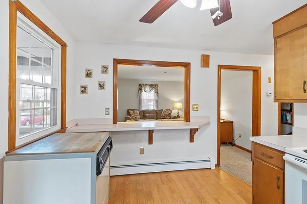 a view of living room with granite countertop furniture and fireplace