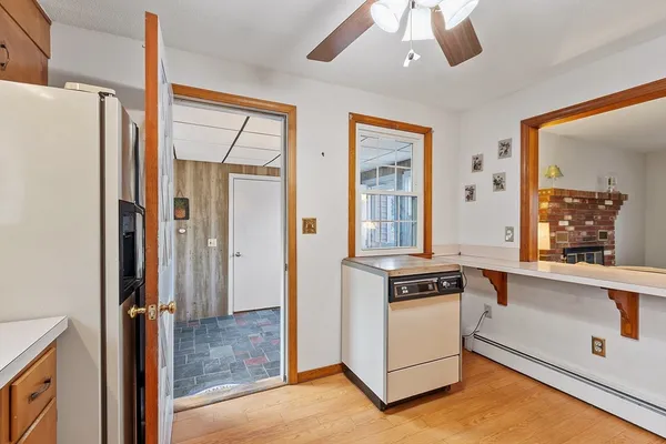 a kitchen with a refrigerator a stove and a microwave