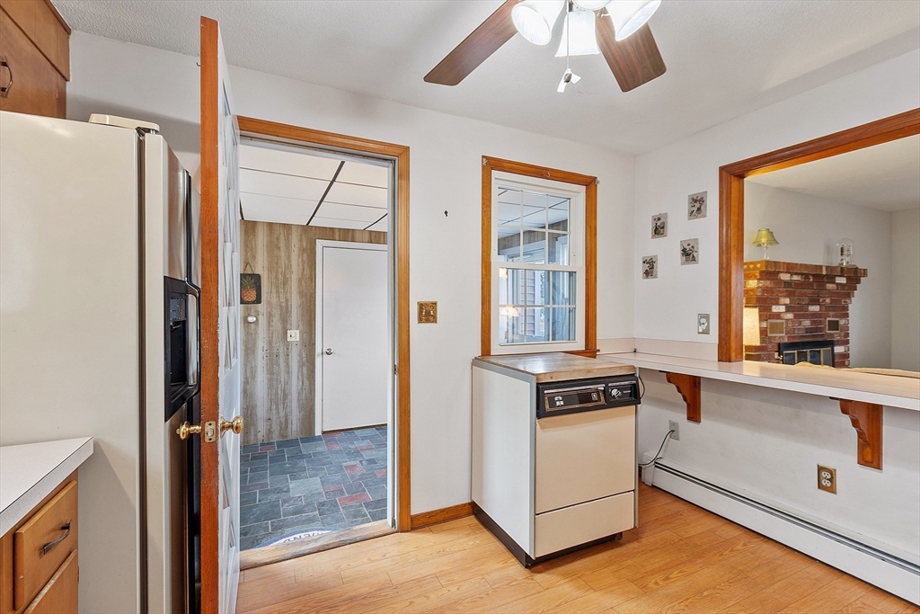 46 Woodruff Road Clinton, MA 01510 - Photo 7 of 38 a kitchen with a refrigerator a stove and a microwave